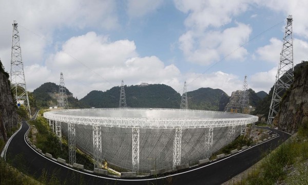 Photo shows the Five-hundred-meter Aperture Spherical Radio Telescope, also known as the FAST, in southwest China's Guizhou province. It is the world's largest single-dish radio telescope. (By Deng Gang/People's Daily Online)