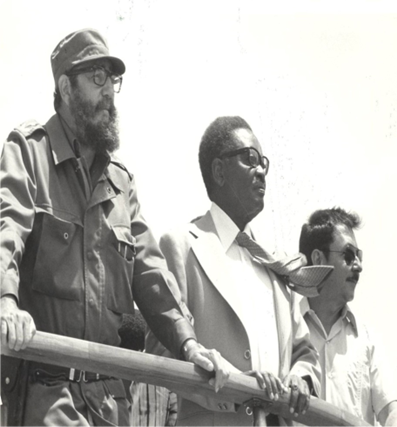 President Neto with Fidel Castro and his brother Raul Castro during a visit to Cuba