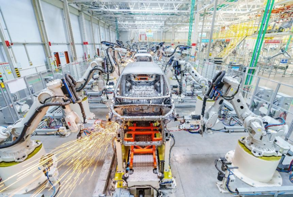 Robotic arms weld new energy vehicle frames in an intelligent workshop of Chinese automaker Dayun in Yuncheng, north China's Shanxi province, Dec. 8, 2022. (Photo by Yan Xin/People's Daily Online)