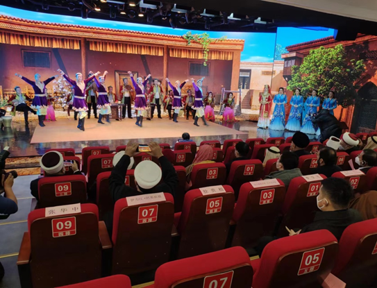 A delegation of world-renowned Islamic figures and scholars enjoy performances of the Twelve Muqams, a traditional art form known as the "Mother of Uygur Music".