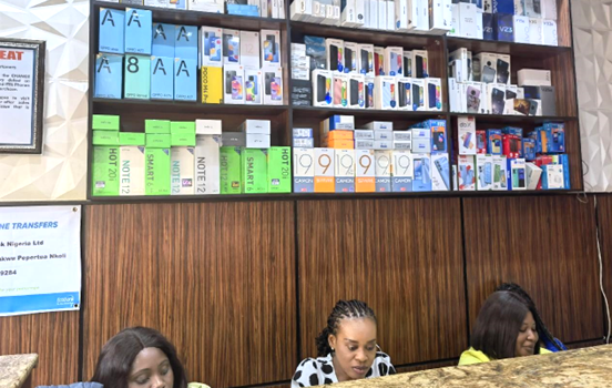 More than half of the mobile phones on the shelves of a mobile phone store in Abuja, capital of Nigeria, are smartphones of Chinese brands. (Photo by Jiang Xuan/People's Daily)