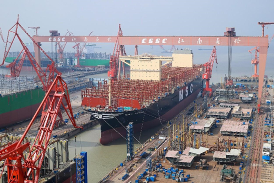 An ultra-large container vessel with a capacity of 24,116 TEUs (20-foot equivalent units) undocks at Changxing Shipbuilding Base in east China's Shanghai. (Photo/Official website of Hudong-Zhonghua Shipbuilding [Group] Co., Ltd.)
