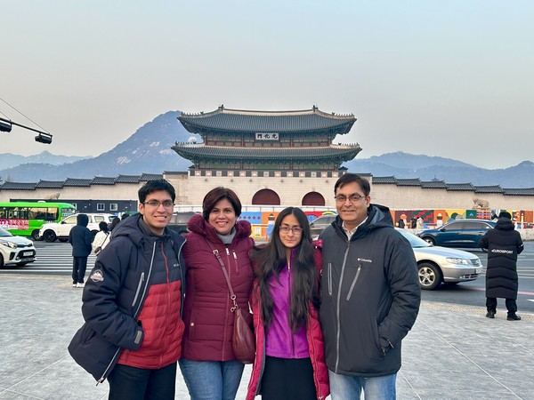 Ambassador Amit Kumar of India (far right) and his family members take a photo in front of Gwanghwamun in Seoul.
