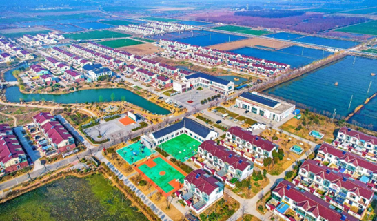 Photo taken on March 6, 2023 shows rows of houses neatly built in Zhenyou community, Xinzhuang township, Suyu district, Suqian, east China's Jiangsu province. (Photo by Chen Shaoshuai/People's Daily Online) 