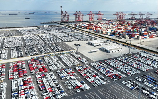 Vehicles to be exported are parked in a storage yard of Taicang port, east China's Jiangsu province. (Photo by Ji Haixin/People's Daily Online)