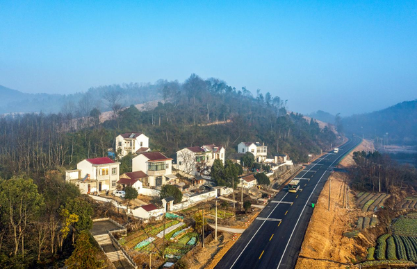 Photo taken on Jan. 4, 2023 shows a rural road in Fanchang district, Wuhu, east China's Anhui province. The district has enhanced its efforts to improve road construction in rural areas over the recent years, in a bid to promote rural tourism and contribute to rural vitalization. (Photo by Xiao Benxiang/People's Daily Online)