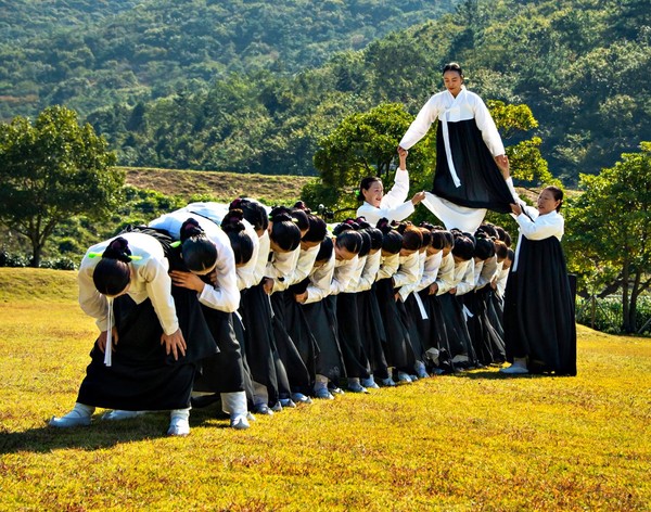 Another form of traditional game for women in the Jindo region where a sepected woman walk on the shoulders of a group of other women.