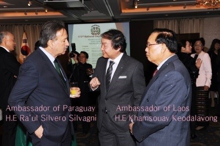 Ambassador Raul Silvero Silvagni of Paraguay (left) speaks with Chairman Shin of ICFW (center) while Ambassador Khamsouay Keodalavong of the Republic looks on at right.