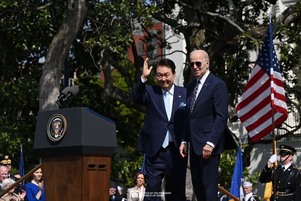 President Yoon Suk-yeol poses with U.S. President Joe Biden in the U.S.