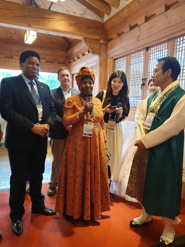 Charge d'Affaires Wray Mulendema Ham Weene of Zambia speaks at the opening ceremony of the 2023 Chunhyang Festival in Namwon on May 26, 2023 with Mayor Choi watching her at right.