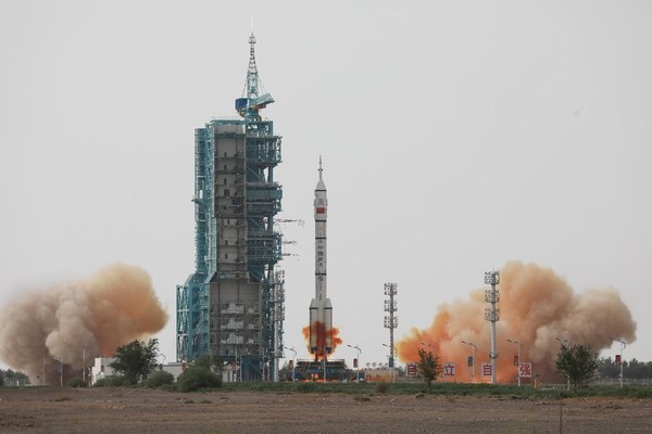 The Shenzhou-16 manned spaceship, atop a Long March-2F carrier rocket, blasts off from the Jiuquan Satellite Launch Center in northwest China, May 30, 2023. (Photo by Cao Hongzu/People's Daily Online)