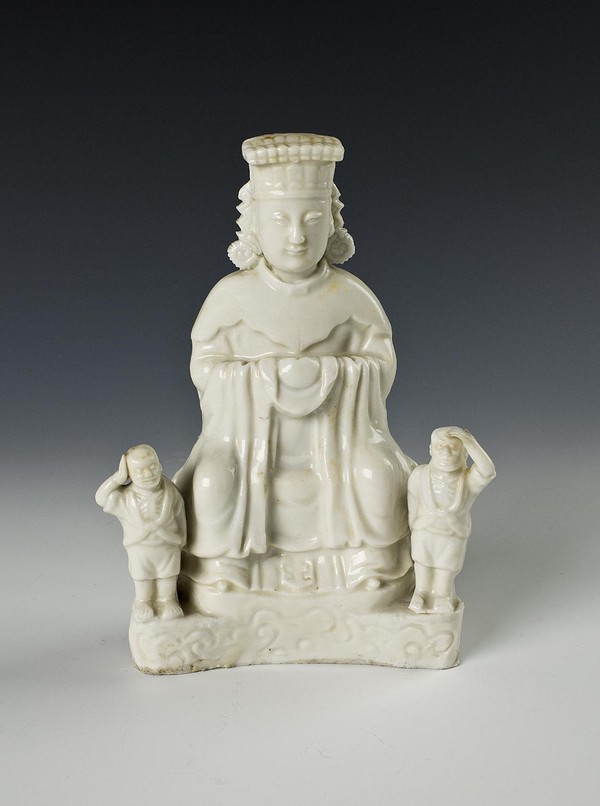 Photo shows a sitting statue of Chinese sea goddess Mazu made of white-glazed porcelain, which is displayed at an exhibition featuring the cultural imprint of the Maritime Silk Road held at Fujian Museum in Fuzhou, southeast China's Fujian province. The statue was made in a kiln in Dehua county, Quanzhou, southeast China's Fujian province, in China's Ming Dynasty (1368-1644). (Photo courtesy of Fu Qisheng)