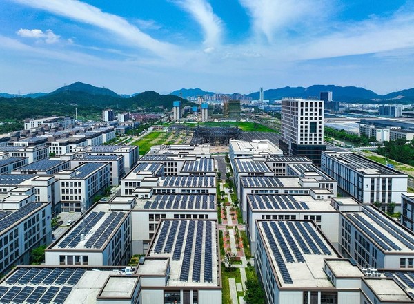 Photovoltaic panels are seen on roofs of buildings in an industrial park in Ningbo, east China's Zhejiang province. (Photo by Hu Xuejun/People's Daily Online)