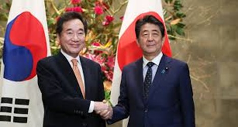 The then Prime Minister Lee shakes hands with his Japanese counterpart, Prime Minister Shinzo Abe prior of Japan, prior to their meeting at Abe's official residence in Tokyo on Oct 24, 2019