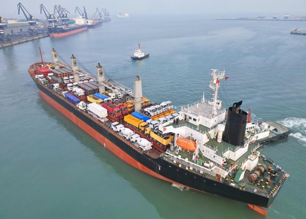 A giant ship carrying some 190 engineering vehicles leaves the port of Yantai, east China's Shandong province for the port of Dar es Salaam, Tanzania, Feb. 23, 2023. (Photo by Tang Ke/People's Daily Online)
