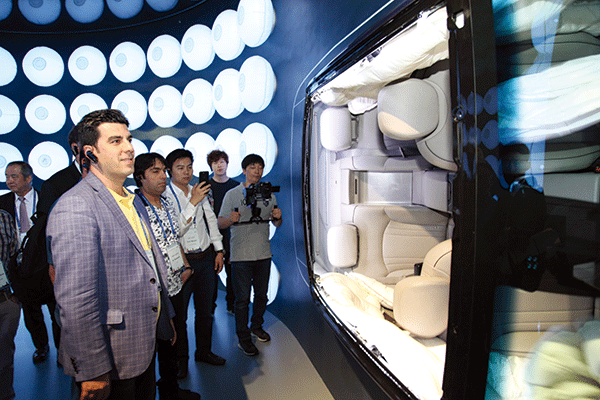 Photo shows foreign business representatives viewing exhibits at one of the Hyundai Steel showrooms.