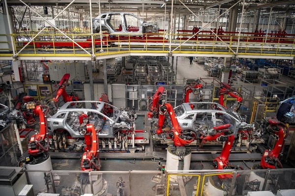 New energy vehicles are manufactured in an intelligent workshop of Chinese automobile manufacturer Leapmotor in Jinhua, east China's Zhejiang province. (Photo by Hu Xiaofei/People's Daily Online)