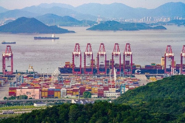 Photo taken on Aug. 6, 2023 shows a busy scene of a container terminal of the Zhoushan port in Ningbo, east China's Zhejiang province. The Zhoushan port has 301 maritime routes to over 600 ports in more than 200 countries and regions. In particular, 125 of the routes are related to the Belt and Road cooperation, up 71.2 percent from 2013. (Photo by Zhang Yongtao/People's Daily Online) 
