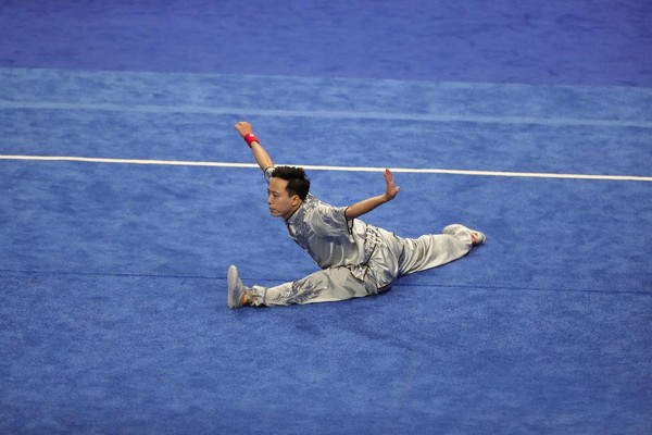 Sun Peiyuan competes at the men's Changquan final of Wushu at the 19th Asian Games in Hangzhou, east China's Zhejiang province, Sept. 24, 2023. (Photo by Mi Jiafeng/People's Daily Online)