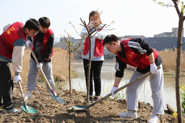 A tree planting activity is held in Leidian township, Deqing county, Huzhou, east China's Zhejiang province to mark the Hangzhou Asian Games, March 13, 2023. (Photo by Li Xuan/People's Daily Online)