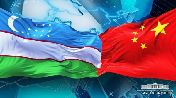 The flag of the Republic of Uzbekistan (left) is joined with that of the People’s Republic of China symbolizing the close ties of relations, friendship and cooperation between the wo countries.
