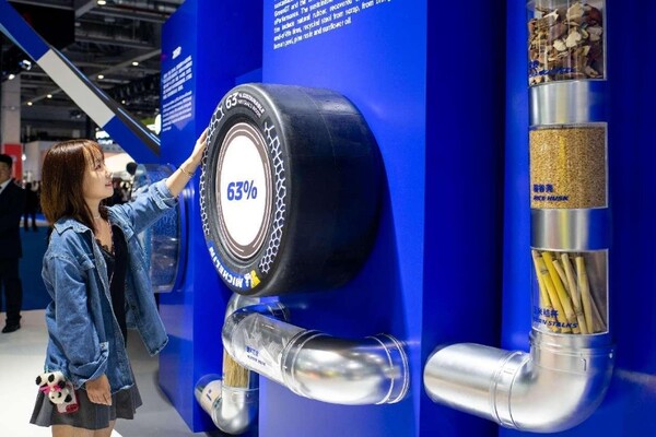 A Michelin racing tire that contains 63 percent of environmentally sustainable materials is exhibited at the sixth China International Import Expo, Nov. 5. (Photo by Weng Qiyu/People's Daily Online