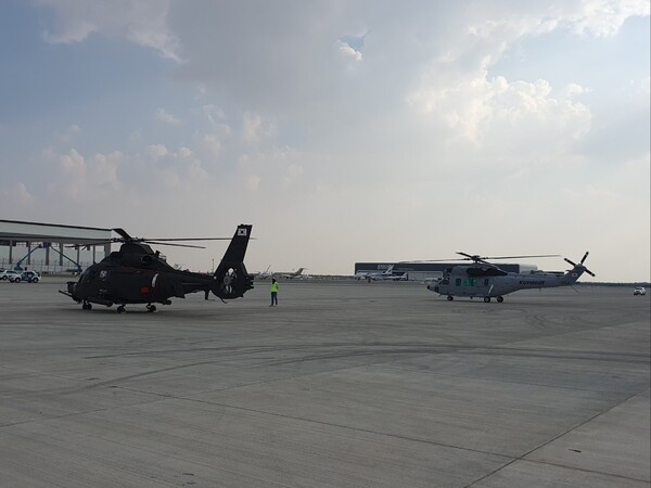 Korea Aerospace Industries Ltd.'s Light Armed Helicopter (L) and the Surion are seen at Al Maktoum International Airport in the United Arab Emirates, in this undated photo provided by the Defense Acquisition Program Administration on Nov. 13, 2023. (PHOTO NOT FOR SALE)