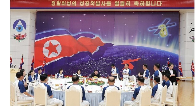 This photo, carried by North Korea's official Korean Central News Agency on Nov. 24, 2023, shows the North holding a banquet in Pyongyang the previous day to celebrate the country's latest successful launch of a military spy satellite. (For Use Only in the Republic of Korea. No Redistribution)