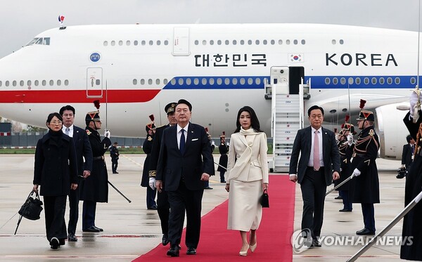 South Korean President Yoon Suk Yeol and first lady Kim Keon Hee arrive at Paris Orly Airport, near Paris, on Nov. 23, 2023.