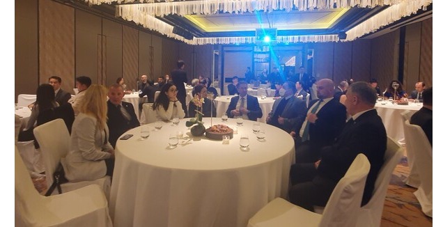 Ambassador and Mrs. Ramin Hasanov of Azerbaijan (5th from left) with Madam (Mrs. Susanne Angerhozer) on his left and daughter (Miss Hasanov) at 3rd from left, speaks with other ambassadors and spouses.Ambassador and Mrs. Andrew Chernetsky of Belarus are seen on the left of the table.