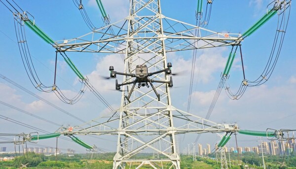 An unmanned aerial vehicle autonomously carries out inspection of power transmission lines in Chuzhou city, east China's Anhui province. (Photo by Song Weixing/People's Daily Online)