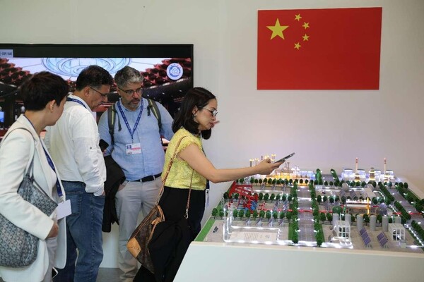 A model of China's first million-ton carbon capture, utilization and storage project is exhibited at the 28th session of the Conference of the Parties to the UN Framework Convention on Climate Change. (Photo by Zhang Zhiwen/People's Daily)