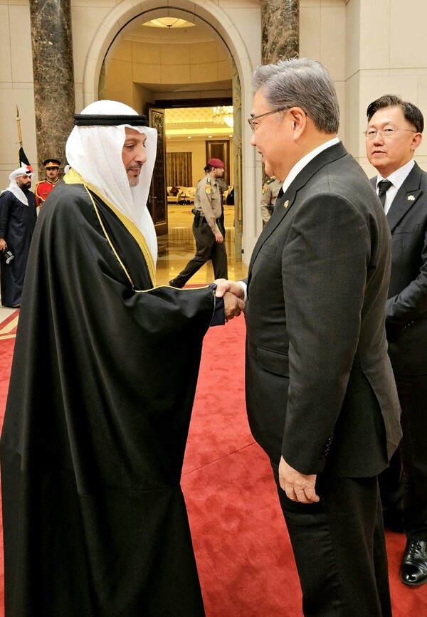 Foreign Minister Park Jin shakes hands with his Kuwaiti counterpart, Salem Abdullah Al Jaber Al Sabah, in the Gulf state on Dec. 18, 2023, in this photo provided by Park's office. Park was visiting Kuwait with a government delegation to pay respects to the late Kuwaiti leader Nawaf Al Ahmed Al Jaber Al Sabah