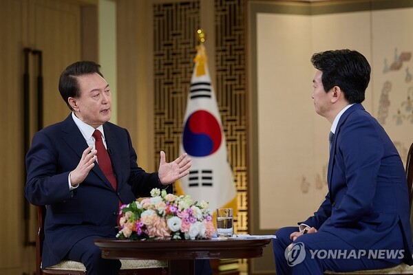 President Yoon Suk Yeol (L) speaks during a special interview with state-run broadcaster KBS at the presidential office in Seoul on Feb. 4, 2024, in this photo provided by the office. (Yonhap)
