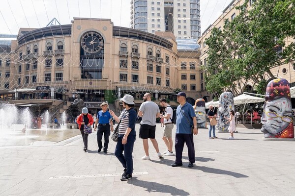 Chinese tourists visit the Nelson Mandela Square in Johannesburg, South Africa. (Photo by Shiraaz)