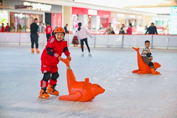 Children skate on an ice rink in a shopping mall in Changji Hui autonomous prefecture, northwest China's Xinjiang Uygur autonomous region, Feb. 13, 2024. (Photo by Tao Weiming/People's Daily Online)