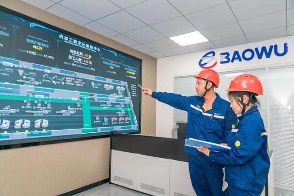 Technicians check the operational status of machine tools in a digital control center of Baosteel Roll Science & Technology Co., Ltd. in Changzhou, east China's Jiangsu province. (Photo by Lu Shiqing/People's Daily Online)
