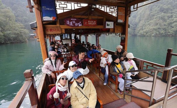 Tourists from Thailand, South Korea visit a scenic spot in Zhangjiajie, central China's Hunan province, March 2, 2024. (Photo by Wu Yongbing/People's Daily Online)