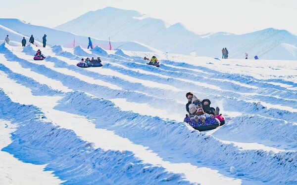 Tourists have fun in a ski resort in Changji Hui autonomous prefecture, northwest China's Xinjiang Uygur autonomous region, Feb. 13, 2024. (Photo by Tao Weiming/People's Daily Online)