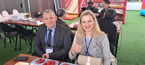 Ambassador Andrew Chernetsky of Belarus poses with Madam Marina Kozhurova who has her thumb up.