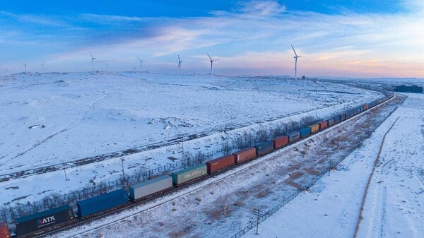 A fully-loaded China-Europe Railway Express freight train runs in Ulanqab, north China Inner Mongolia autonomous region, Feb. 22, 2024. (Photo by Xia Liang/People's Daily Online)