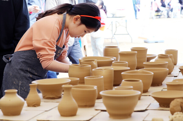 Shaping the clay into a shape is the first step in making pottery