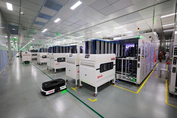 Automated guided vehicles transport battery packs in a workshop of a new energy company in Yibin, southwest China's Sichuan province. (Photo by Lan Feng/People's Daily Online)