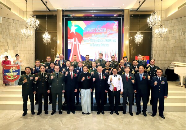 Ambassador Thant Sin (fifth from the left, front row) and Defense Attaché Brigadier General Wint Thu (fourth from the right, front row) pose for a group photo with other attendees. (Source: Embassy of the Republic of the Union of Myanmar, Military, Naval and Air Attaché)